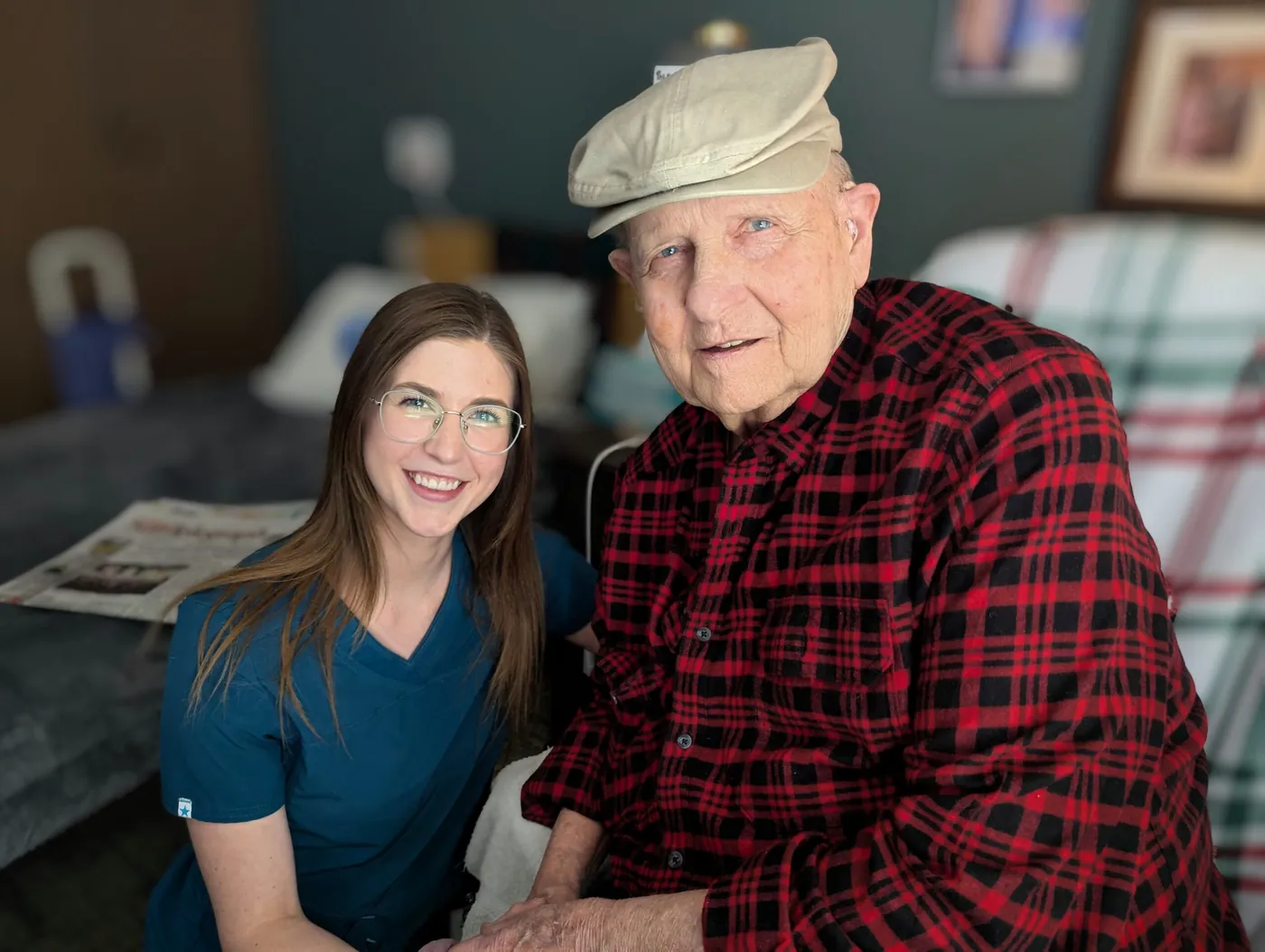 A Pole Creek Estates caregiver sharing a smile with a resident